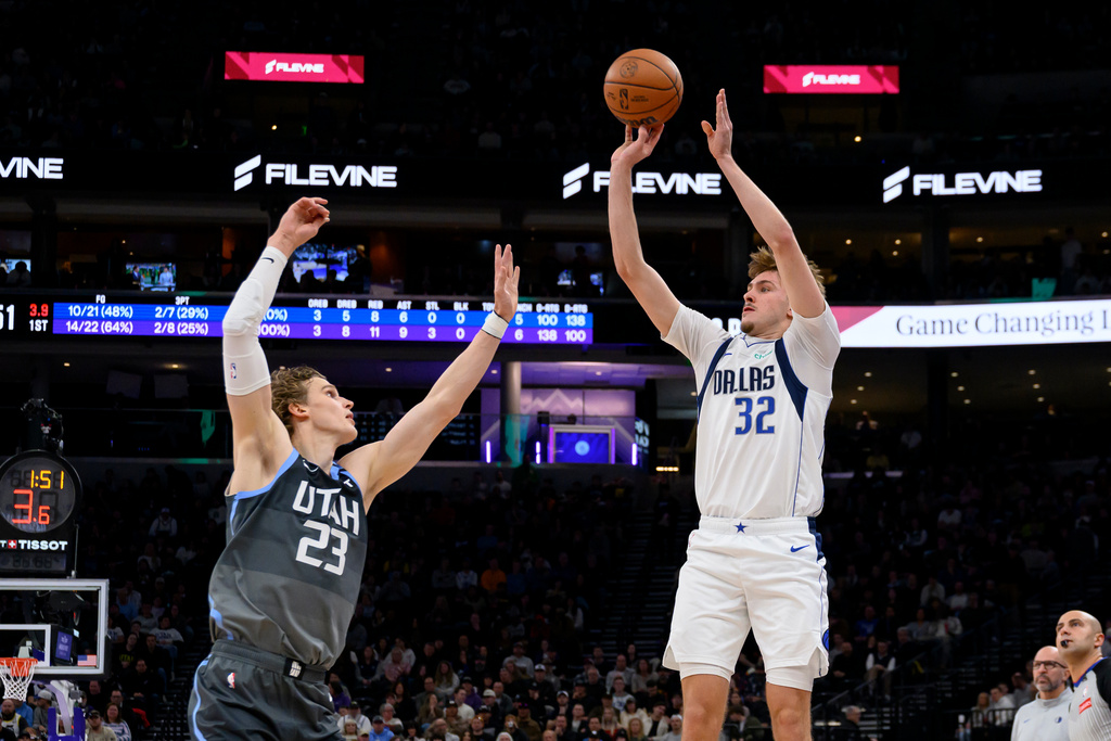 Dallas Mavericks forward Cooper Flagg (32) shoots over Utah Jazz forward Lauri Markkanen (23) during the first half of an NBA basketball game, Thursday, Jan. 8, 2026, in Salt Lake City. (AP Photo/Tyler Tate)