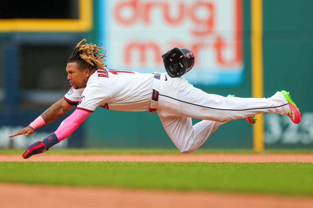 Cleveland Guardians' Jose Ramirez dives but is caught while trying to steal second base during the first inning of a baseball game against the San Diego Padres in Cleveland, Sunday, Aug. 16, 2026. (AP Photo/Tim Phillis)