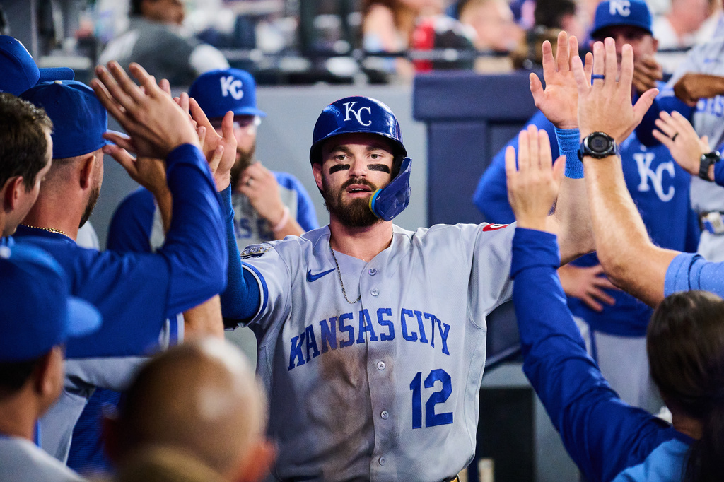 Kansas City Royals' Nick Loftin (12) celebrates with his team after scoring against the Toronto Blue Jays during sixth inning of a baseball game in Toronto, Tuesday, Aug. 25, 2026. (Sammy Kogan/The Canadian Press via AP)