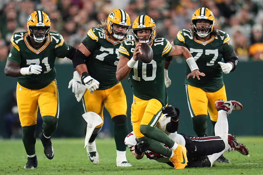 Atlanta Falcons' Cameron Thomas stops Green Bay Packers' Jordan Love on a run during the second half of an NFL football game in Green Bay, Wis., Thursday, Sept. 24, 2026. (AP Photo/Abbie Parr)