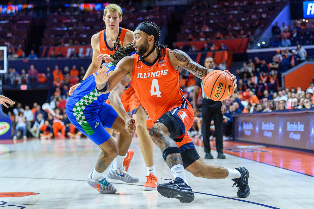 Illinois guard Kylan Boswell drives to the basket during an NCAA college basketball game against Florida Gulf Coast Friday, Nov. 7, 2025, in Champaign, Ill. (AP Photo/Craig Pessman)
