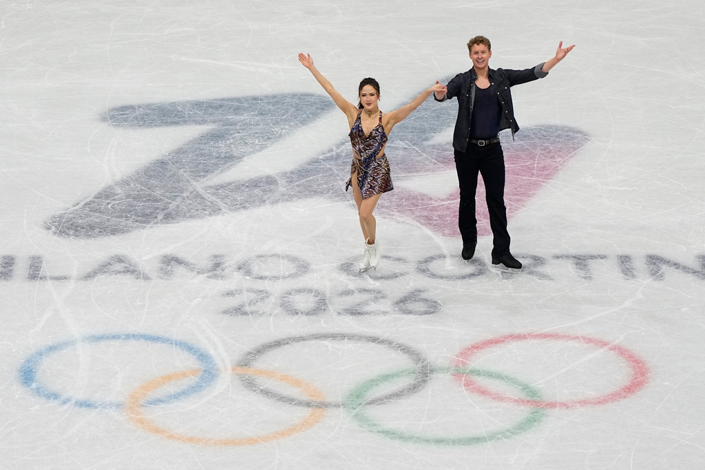 Madison Chock and Evan Bates of the United States compete during the figure skating ice dance team event at the 2026 Winter Olympics, in Milan, Italy, Friday, Feb. 6, 2026. (AP Photo/Ashley Landis)