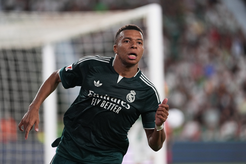 Real Madrid's Kylian Mbappe runs on the pitch during the Spanish La Liga soccer match between Elche and Real Madrid in Elche, Spain, Tuesday, Sept. 15, 2026. (AP Photo/Alberto Saiz)