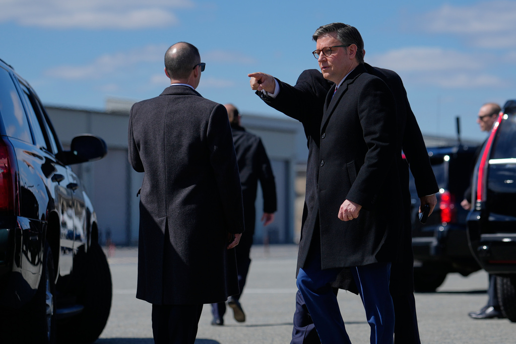 House Speaker Mike Johnson of La., is directed to a vehicle after arriving with President Donald Trump on Air Force One, Wednesday, March 18, 2026, at Dover Air Force Base, Del., to attend the casualty return for the six crew members of an Air Force refueling aircraft who died when their plane crashed in western Iraq while supporting operations against Iran. (AP Photo/Julia Demaree Nikhinson)