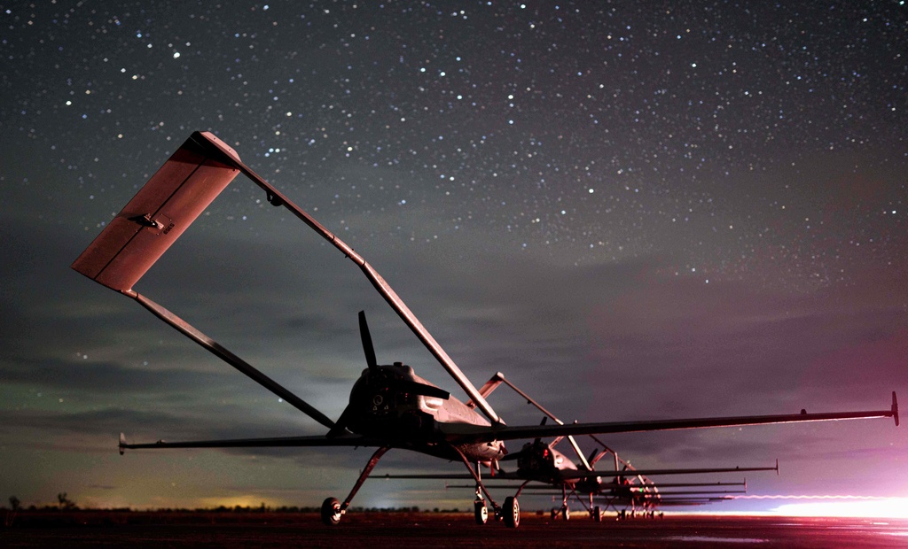Long-range drones An-196 Liutyi of the Ukrainian 14th Separate Unmanned Aerial Systems Regiment stand in line before takeoff in undisclosed location, Ukraine, Tuesday, Oct. 14, 2025. (AP Photo/Evgeniy Maloletka)