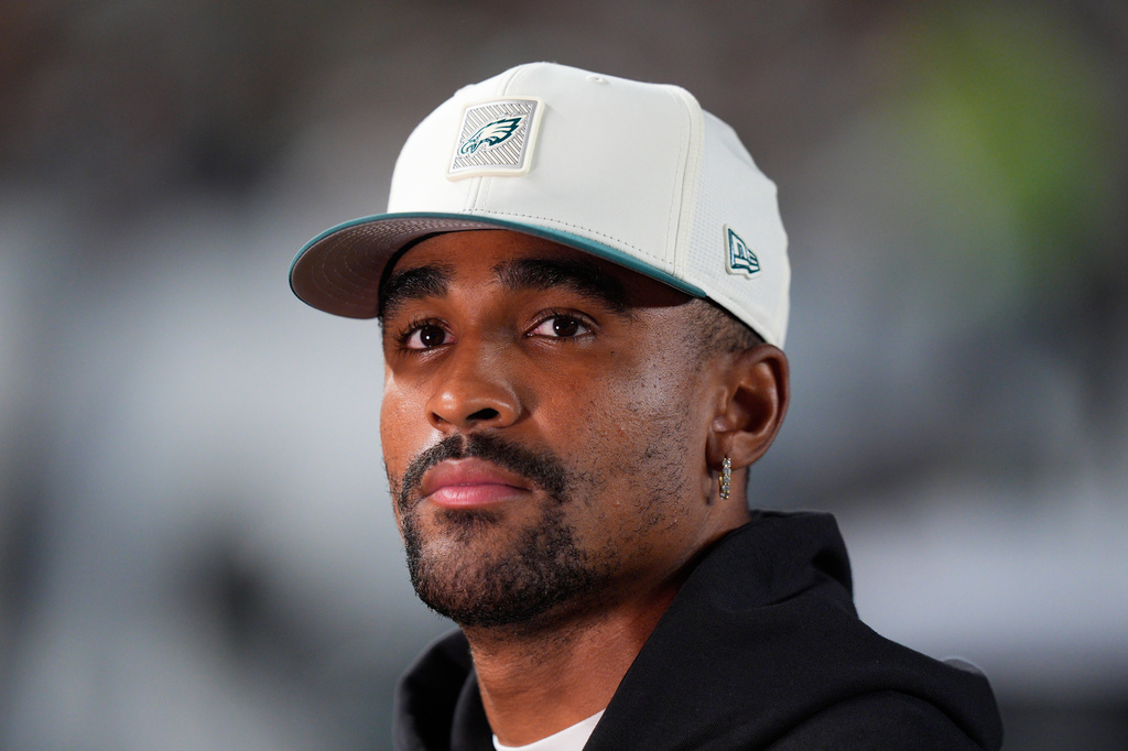 Philadelphia Eagles quarterback Jalen Hurts participates in an interview on the sidelines during the first half of a preseason against the Cincinnati Bengals on NFL football game Friday, Aug. 28, 2026, in Philadelphia. (AP Photo/Chris Szagola)