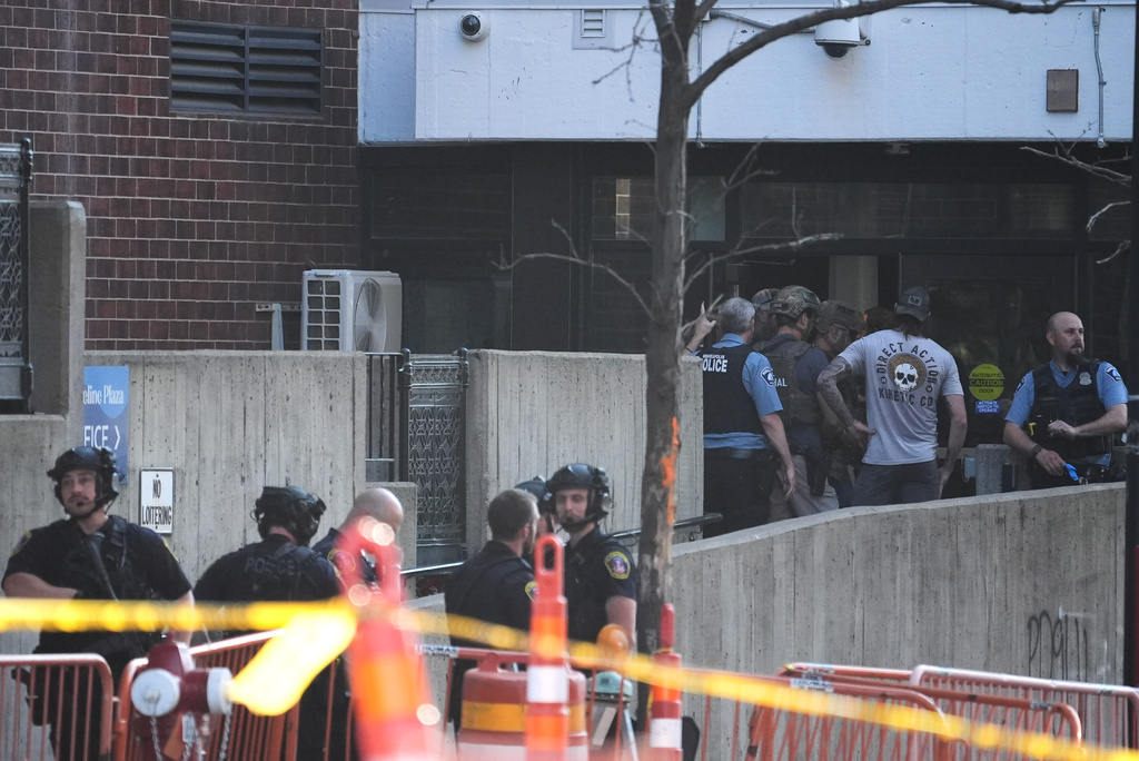 Law enforcement respond to a shooting Wednesday, Sept. 2, 2026, in downtown Minneapolis. (AP Photo/Ellen Schmidt)