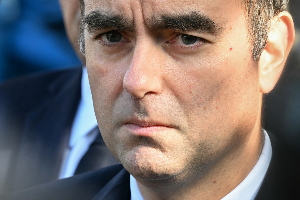 Reappointed French Prime Minister Sebastien Lecornu looks on as he visits a police station in L'Hay-les-Roses, outside Paris, Saturday, Oct. 11, 2025. (Martin Lelievre, Pool Photo via AP)