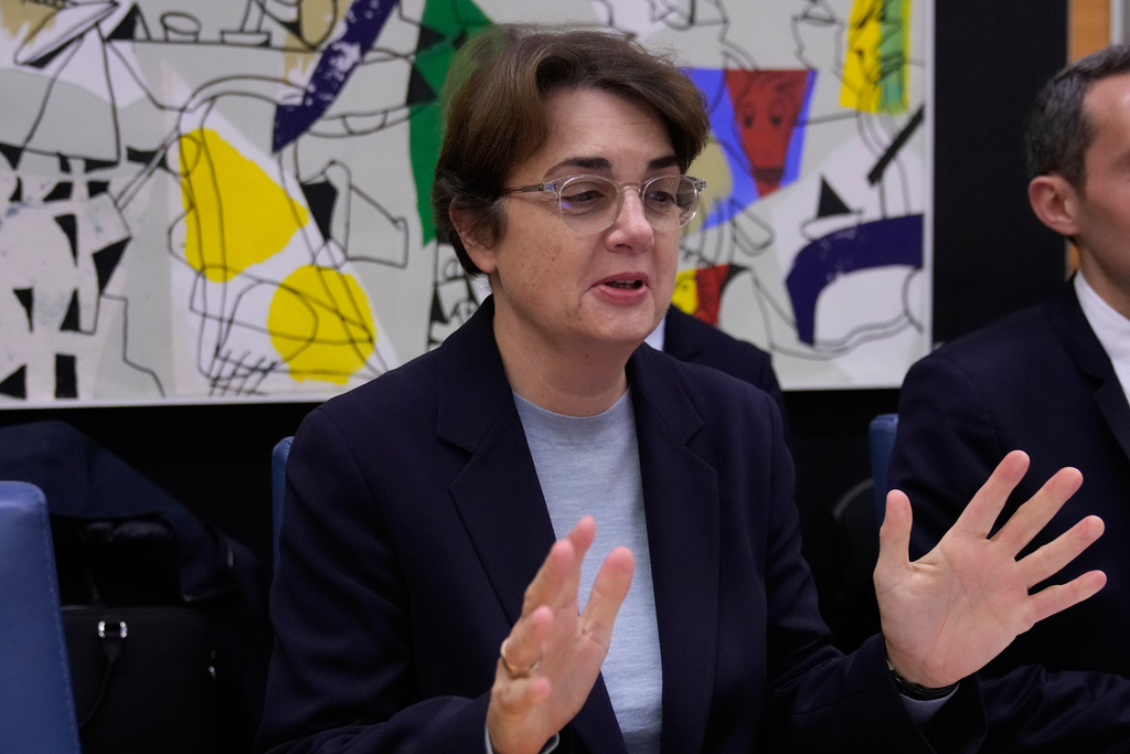 Laurence des Cars, director of Le Louvre museum, gestures before a hearing at the Culture Commission of the National Assembly, Wednesday, Nov. 19, 2025 in Paris. (AP Photo/Michel Euler)