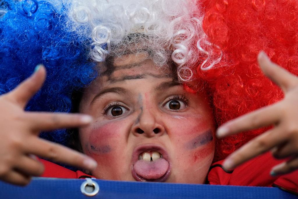 A child poses for a photo prior to a FIFA U-20 World Cup Group A soccer match between Chile and New Zealand at National Stadium in Santiago, Chile, Saturday, Sept. 27, 2025. (AP Photo/Matias Delacroix)
