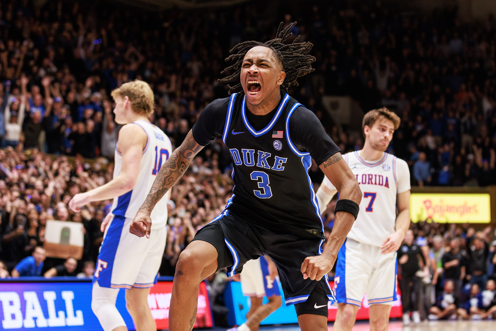 Duke's Isaiah Evans (3) celebrates ahead of Florida's Thomas Haugh (10) and Urban Klavzar (7) as time expires in Duke's victory over Florida in an NCAA college basketball game in Durham, N.C., Tuesday, Dec. 2, 2025. (AP Photo/Ben McKeown)