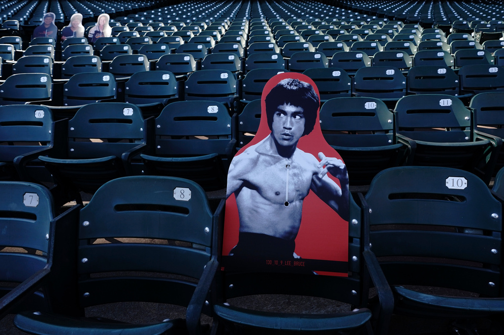 FILE - A cardboard cutout of martial artist Bruce Lee is displayed at Oracle Park before a baseball game between the San Francisco Giants and the San Diego Padres in San Francisco, July 30, 2020. (AP Photo/Jeff Chiu, File)