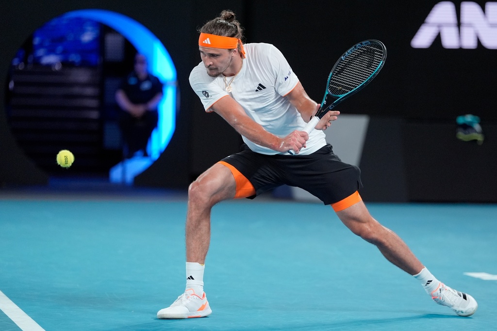 Alexander Zverev of Germany plays a backhand return to Learner Tien of the U.S. during their quarterfinal match at the Australian Open tennis championship in Melbourne, Australia, Tuesday, Jan. 27, 2026. (AP Photo/Asanka Brendon Ratnayake)