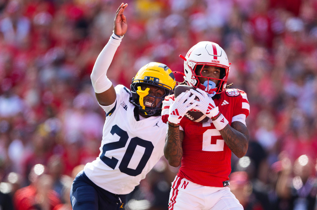 Nebraska's Jacory Barney Jr. (2) catches a touchdown pass ahead of Michigan's Jyaire Hill (20) during the first half of an NCAA college football game Saturday, Sept. 20, 2025, in Lincoln, Neb. (AP Photo/Rebecca S. Gratz)