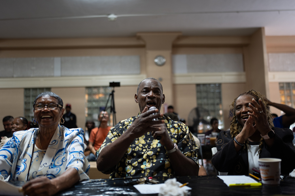 Judges Teressa Percell, from left, Rev. Gary Carr and evangelist Geraldine Hughes share a laugh while talking to a contestant during Skid Row's inaugural talent show in downtown Los Angeles, Saturday, Sept. 19, 2026. (AP Photo/Jae C. Hong)