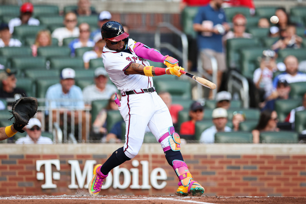 Atlanta Braves' Ronald Acuña Jr. hits a two-run home run in the first inning of a baseball game against the Pittsburgh Pirates, Sunday, Sept. 28, 2025, in Atlanta. (AP Photo/Colin Hubbard)