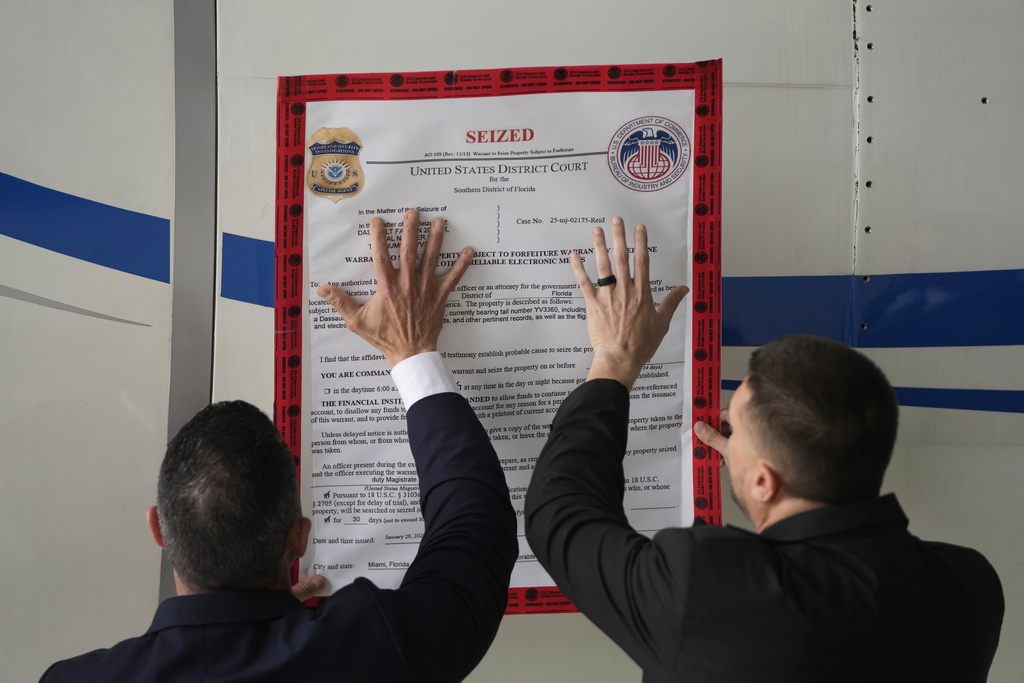 FILE - A "seized" sign is placed on a Venezuelan government airplane during a news conference where U.S. Secretary of State Marco Rubio announced its seizure at La Isabela International Airport in Santo Domingo, Dominican Republic, Thursday, Feb. 6, 2025. (AP Photo/Mark Schiefelbein, Pool, File)