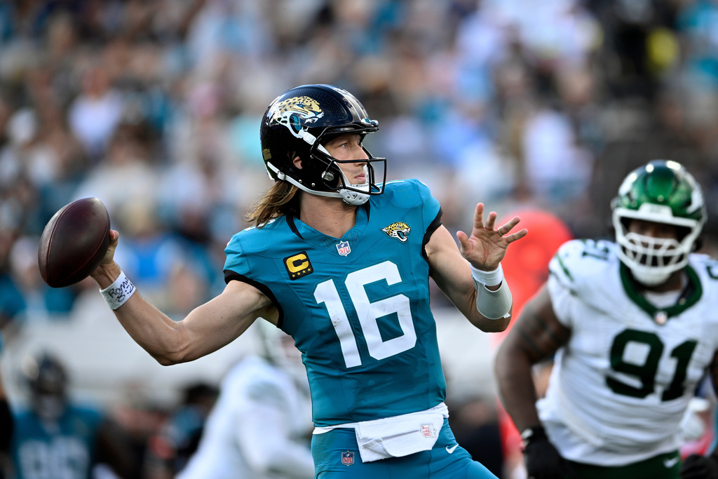 Jacksonville Jaguars quarterback Trevor Lawrence (16) throws a pass against the New York Jets during the second half of an NFL football game, Sunday, Dec. 14, 2025, in Jacksonville, Fla. (AP Photo/Phelan M. Ebenhack)