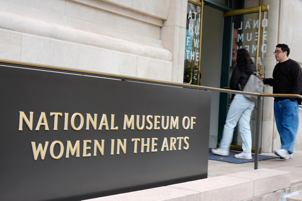 People are seen entering the main entrance to the National Museum of Women in the Arts in downtown Washington, Wednesday, Oct. 29, 2025. (AP Photo/Pablo Martinez Monsivais)