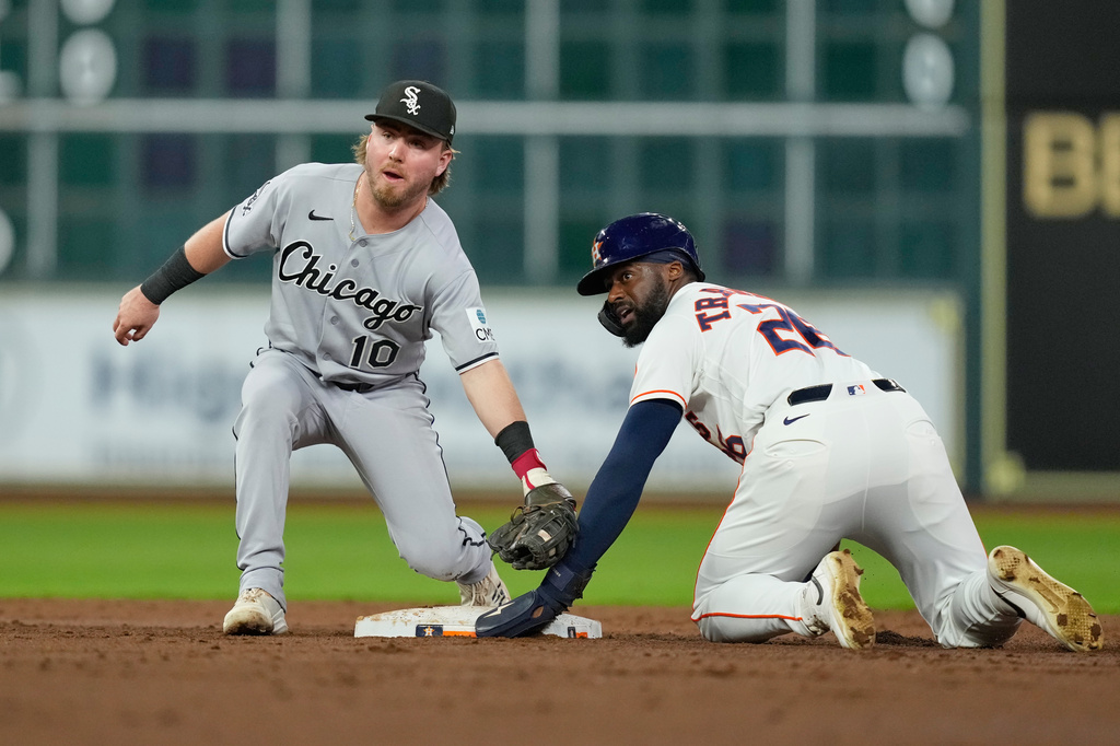 Houston Astros' Taylor Trammell (26) steals second base as Chicago White Sox second baseman Chase Meidroth (10) reaches to tag him during the second inning of a baseball game Tuesday, Sept. 1, 2026, in Houston. (AP Photo/David J. Phillip)