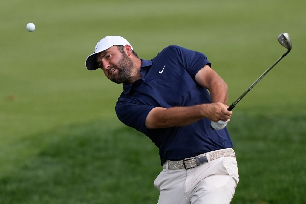 Scottie Scheffler hits from the second fairway during the final round of The Players Championship golf tournament, Sunday, March 15, 2026, in Ponte Vedra Beach, Fla. (AP Photo/Gerald Herbert)