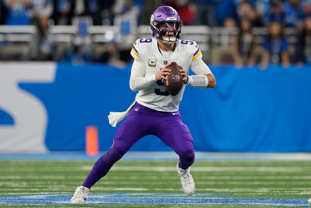 Minnesota Vikings quarterback J.J. McCarthy (9) looks to pass during the first half of an NFL football game against the Detroit Lions Sunday, Nov. 2, 2025, in Detroit. (AP Photo/Ryan Sun)