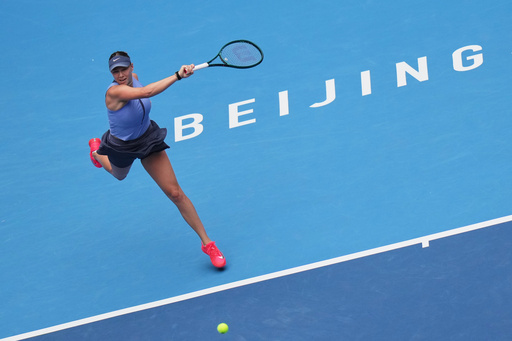 Amanda Anisimova, of the United States plays a forehand return to her compatriot Coco Gauff during the women's singles semifinals match of the China Open tennis tournament, at the National Tennis Center, in Beijing, Saturday, Oct. 4, 2025. (AP Photo/Andy Wong) Amanda Anisimova, of the United States plays a forehand return to her compatriot Coco Gauff during the women's singles semifinals match of the China Open tennis tournament, at the National Tennis Center, in Beijing, Saturday, Oct. 4, 2025. (AP Photo/Andy Wong)