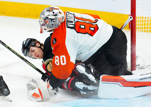 Ottawa Senators' Ridly Greig (71) slams into Philadelphia Flyers goaltender Dan Vladar (80) during third period NHL hockey action in Ottawa on Thursday, Oct. 23, 2025. (Sean Kilpatrick/The Canadian Press via AP) Ottawa Senators' Ridly Greig (71) slams into Philadelphia Flyers goaltender Dan Vladar (80) during third period NHL hockey action in Ottawa on Thursday, Oct. 23, 2025. (Sean Kilpatrick/The Canadian Press via AP)