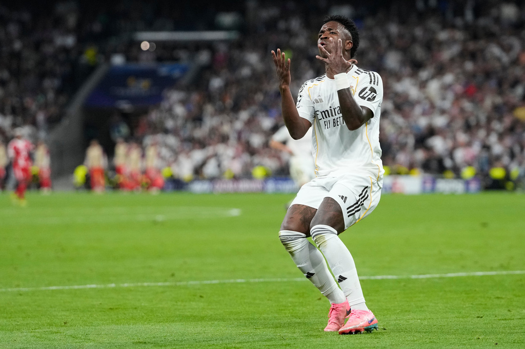 Real Madrid's Vinicius Junior reacts during the Champions League quarterfinal first leg soccer match between Real Madrid and Bayern Munich in Madrid, Spain, Tuesday, April 7, 2026. (AP Photo/Bernat Armangue)
