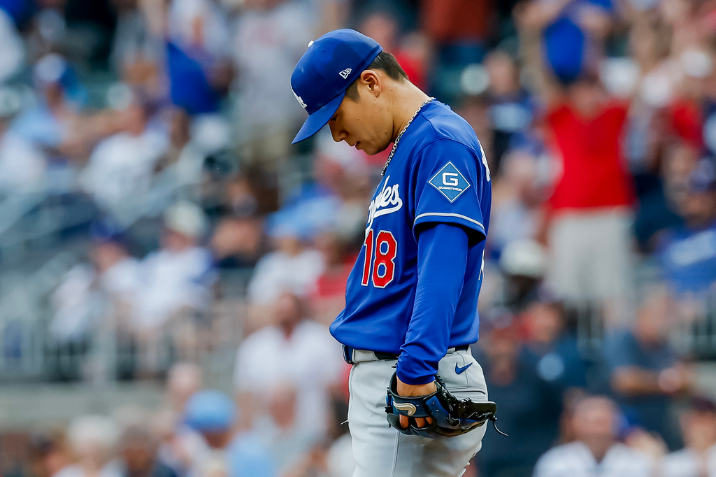 Los Angeles Dodgers pitcher Yoshinobu Yamamoto reacts after giving up a leadoff solo home run to Atlanta Braves' Drake Baldwin during the first inning of a baseball game, Thursday, Aug. 27, 2026, in Atlanta. (AP Photo/Erik S. Lesser)