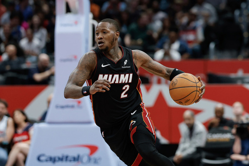 FILE - Miami Heat guard Terry Rozier (2) brings the ball up court during the second half of an NBA basketball game against the Washington Wizards in Washington, Monday, March 31, 2025. (AP Photo/Terrance Williams, File) FILE - Miami Heat guard Terry Rozier (2) brings the ball up court during the second half of an NBA basketball game against the Washington Wizards in Washington, Monday, March 31, 2025. (AP Photo/Terrance Williams, File)