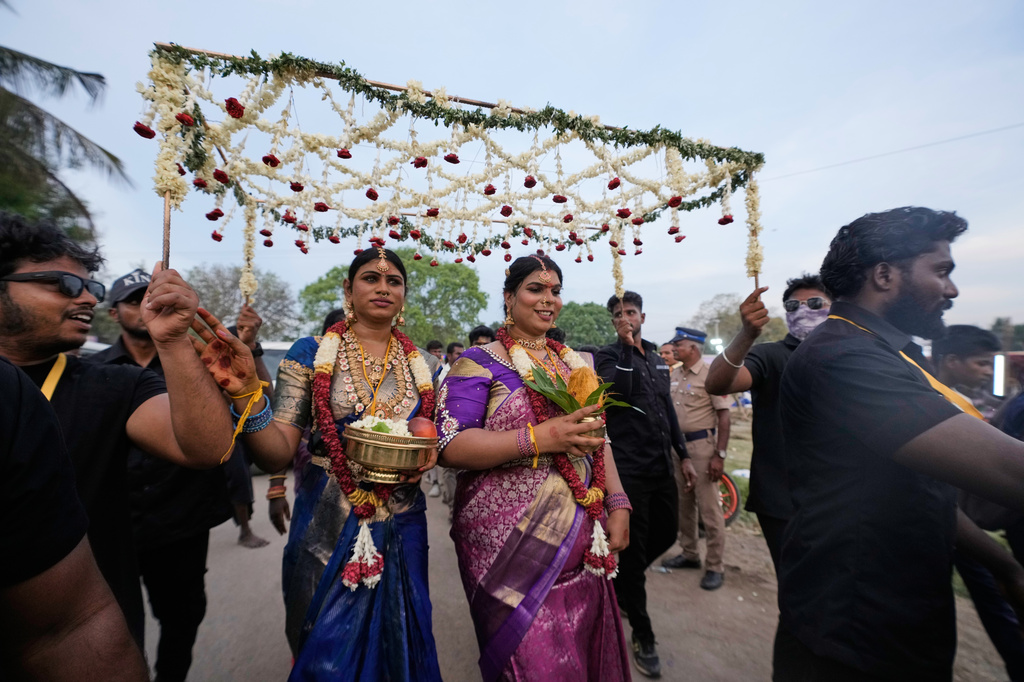 Transgender participants celebrate amid fanfare after symbolically marrying the Hindu god Aravan during the Koovagam festival in the Kallakurichi district of the southern Indian state of Tamil Nadu, Tuesday, April 28, 2026. (AP Photo/Mahesh Kumar A.)