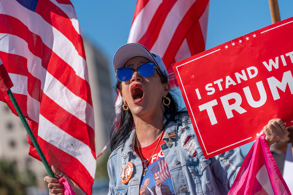 Maribel Gonzalez celebrates outside Versailles Cuban Cuisine after President Donald Trump announced President Nicolás Maduro had been captured and flown out of Venezuela, in Miami, Saturday, Jan. 3, 2026. (AP Photo/Jen Golbeck)