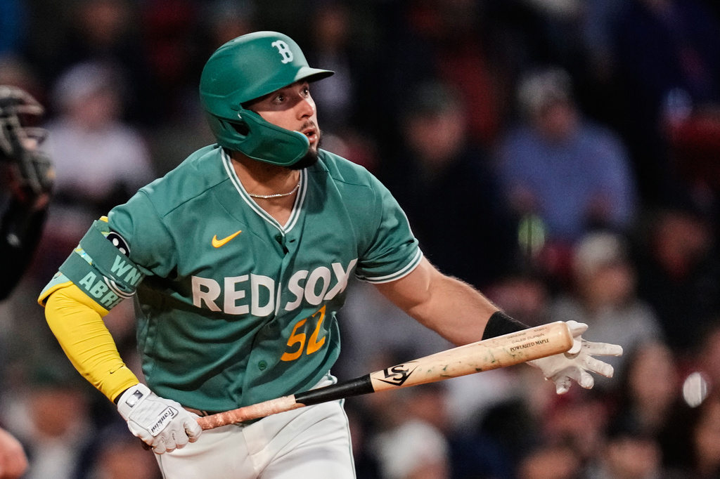 Boston Red Sox's Wilyer Abreu watches the flight of his solo home run during the third inning of a baseball game against the Tampa Bay Rays, Friday, May 8, 2026, in Boston. (AP Photo/Charles Krupa)
