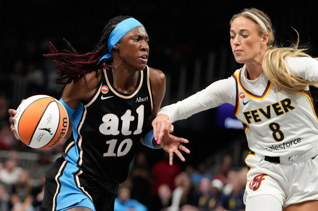 Atlanta Dream guard Rhyne Howard (10) dribbles against Indiana Fever guard Sophie Cunningham (8) in the first half of an WNBA basketball game Sunday, Aug. 16, 2026, in Atlanta. (AP Photo/Brynn Anderson)