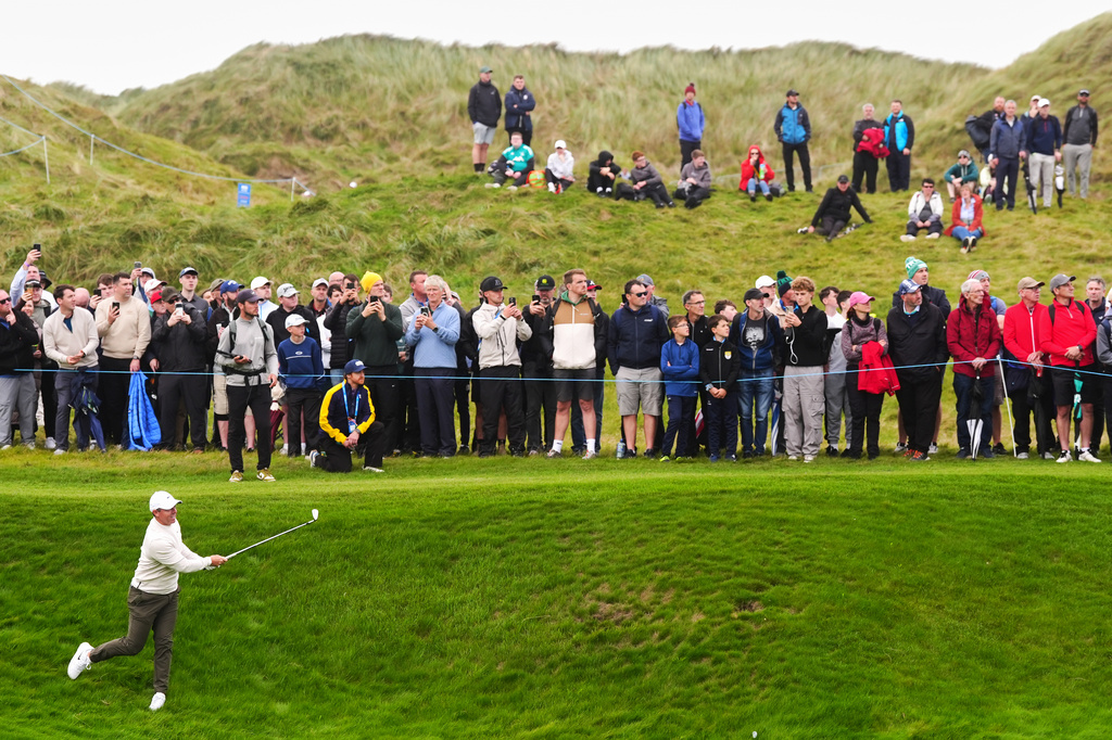 Rory McIlroy, of Northern Ireland, plays from rough on the fourth hole during the first round of the Irish Open golf tournament, Thursday, Sept. 10, 2026, in Doonbeg, Ireland. (Brian Lawless/PA via AP)