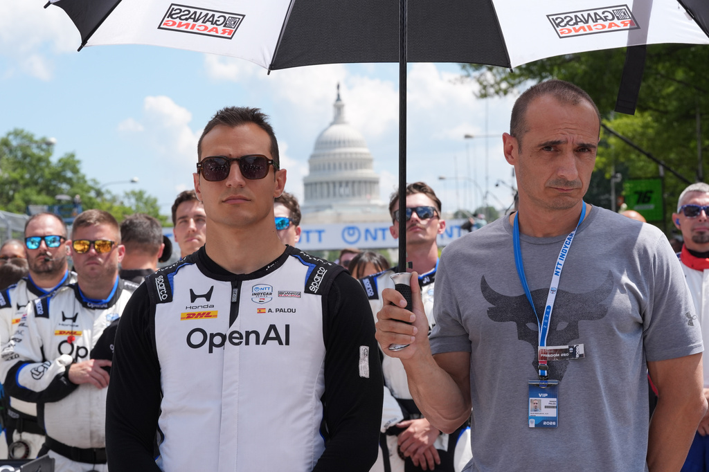 Alex Palou (10) of Spain stands during the National Anthem before the IndyCar Freedom 250 Grand Prix auto race in Washington, Sunday, Aug. 23, 2026. (AP Photo/Alex Brandon)