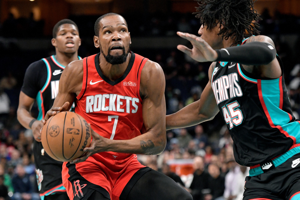 Houston Rockets forward Kevin Durant (7) handles the ball against Memphis Grizzlies forward GG Jackson II (45) in the first half of an NBA basketball game Friday, March 27, 2026, in Memphis, Tenn. (AP Photo/Brandon Dill)