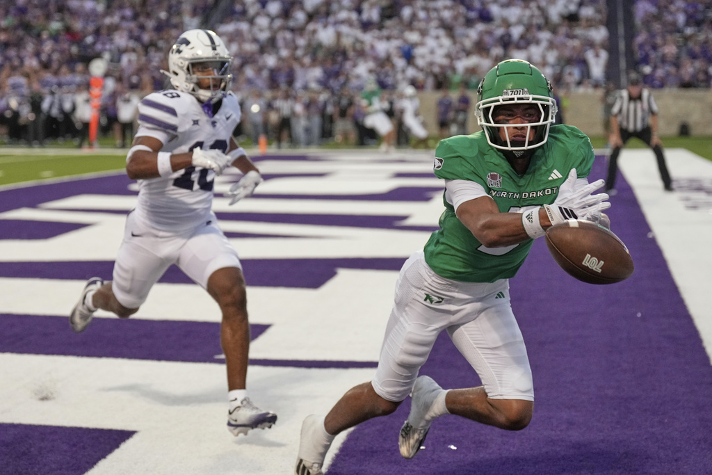 North Dakota wide receiver Nate DeMontagnac (3) can't catch a long pass in the end zone for a touchdown as he is chased by Kansas State safety Wesley Fair (18) during the first half of an NCAA college football game Saturday, Aug. 30, 2025, in Manhattan, Kan. (AP Photo/Charlie Riedel)