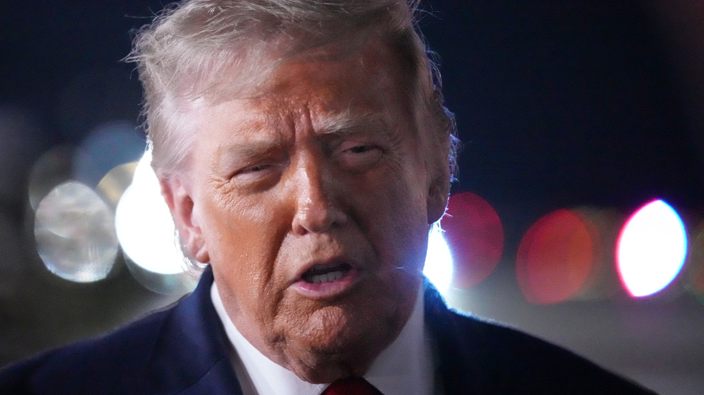 President Donald Trump talks with reporters before boarding Air Force One at John F. Kennedy International Airport in New York, early Tuesday, June 9, 2026. (AP Photo/Mark Schiefelbein)
