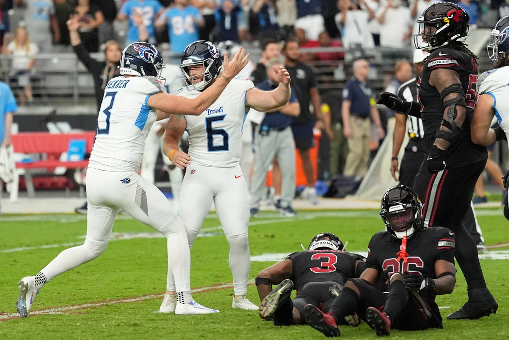 Tennessee Titans punter Johnny Hekker (3) congratulates place-kicker Joey Slye (6) after making a game winning field goal during the second half of an NFL football game against the Arizona Cardinals, Sunday, Oct. 5, 2025, in Glendale, Ariz. (AP Photo/Ross D. Franklin)