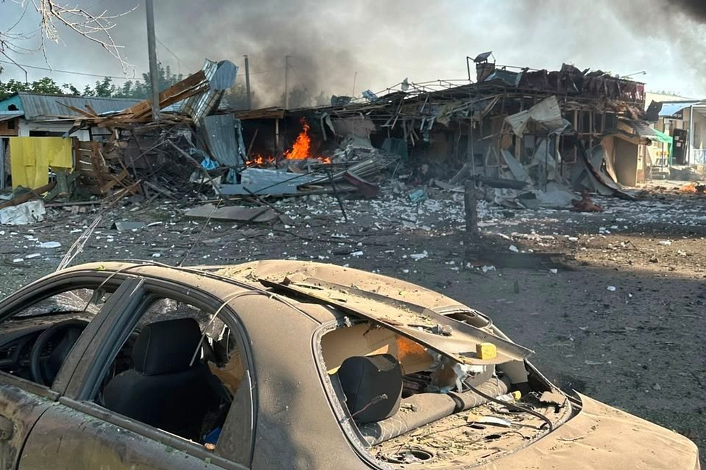 In this photo, provided by the Ukrainian Emergency Service, fire is seen on the site of a Russian air attack in Pechenihy, Kharkiv region, Ukraine, Tuesday, Aug. 18, 2026. (Ukrainian Emergency Service via AP)