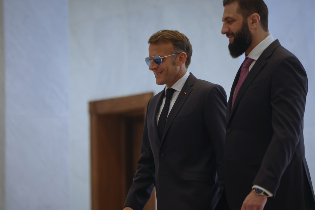 Syrian President Ahmad al-Sharaa, right, meets French President Emmanuel Macron at the presidential palace in Damascus, Syria, Tuesday, July 7, 2026. (AP Photo/Ghaith Alsayed)