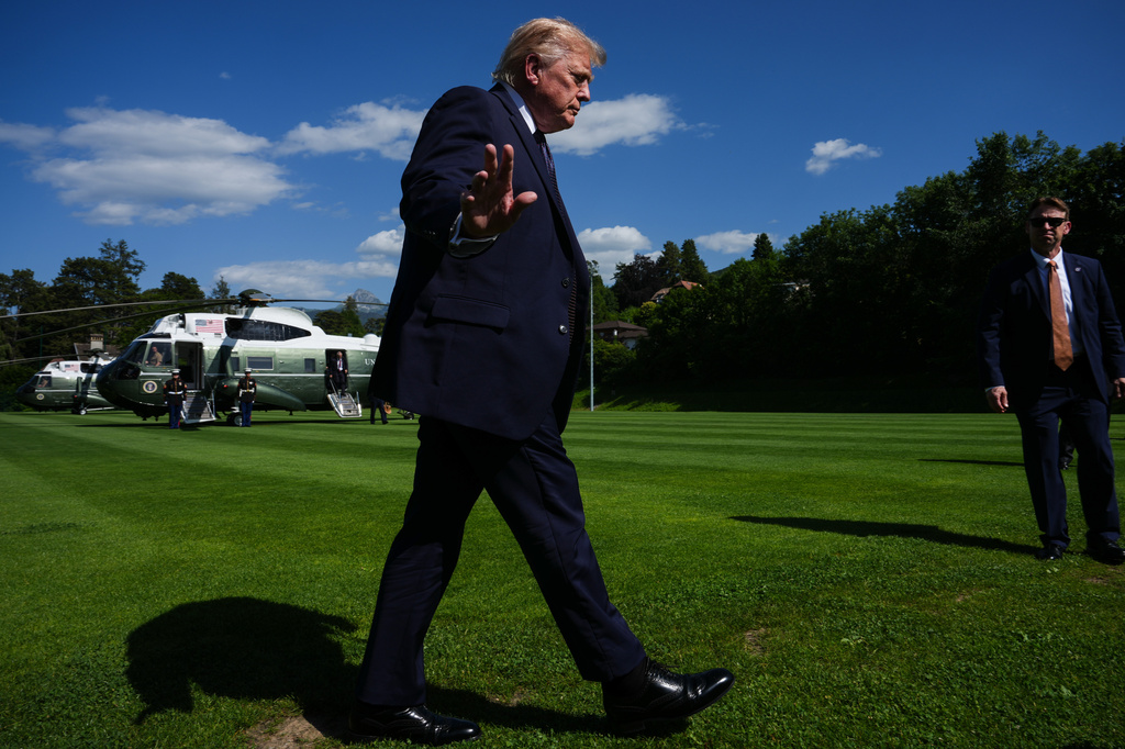 President Donald Trump waves to reporters as he arrives for the G7 summit, Monday, June 15, 2026, in Evian-les-Bains, France. (AP Photo/Julia Demaree Nikhinson)