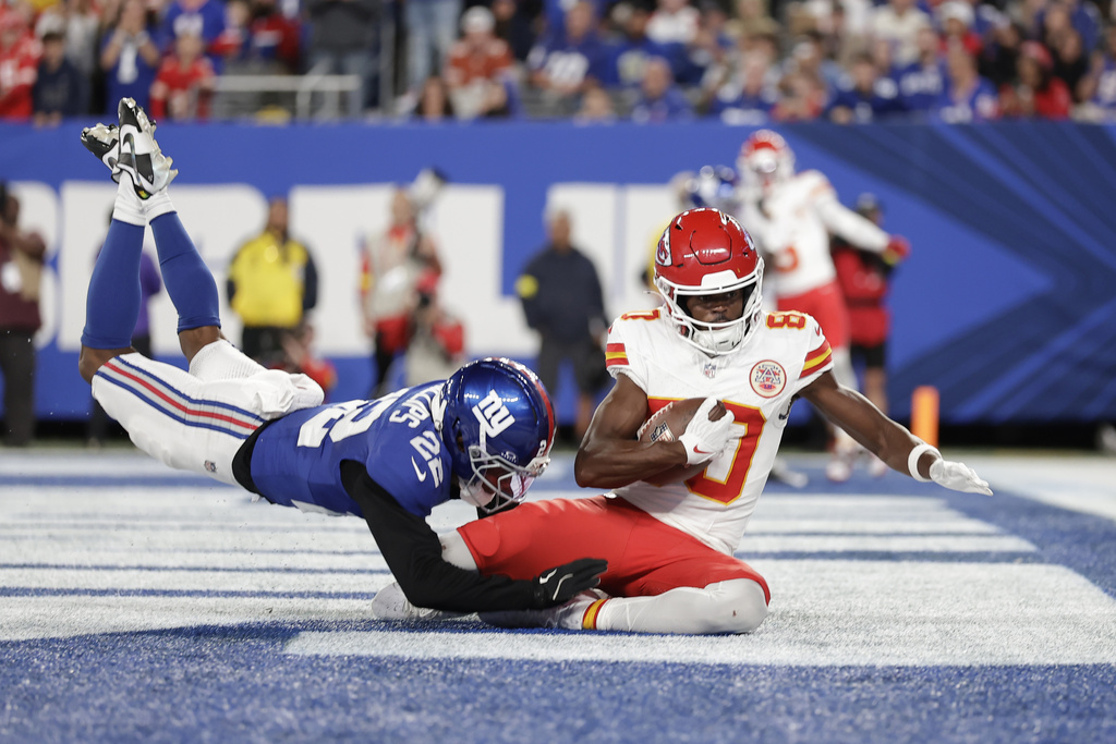 Kansas City Chiefs wide receiver Tyquan Thornton (80) scores as New York Giants cornerback Dru Phillips (22) defends during the second half of an NFL football game Sunday, Sept. 21, 2025, in East Rutherford, N.J. (AP Photo/Adam Hunger)