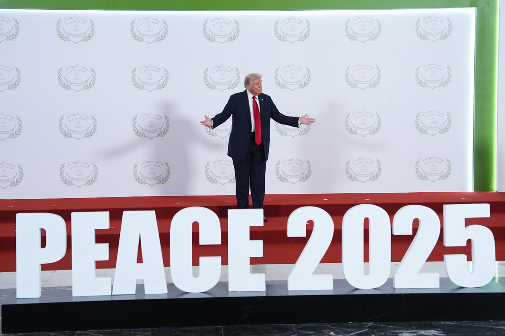 President Donald Trump waits to greet leaders during a summit to support ending the more than two-year Israel-Hamas war in Gaza after a breakthrough ceasefire deal, Monday, Oct. 13, 2025, in Sharm El Sheikh, Egypt. (AP Photo/Evan Vucci, Pool)