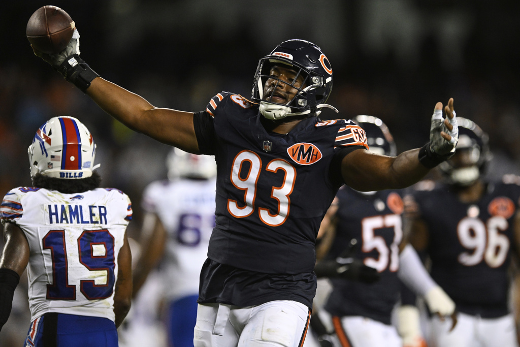 Chicago Bears defensive end Xavier Carlton (93) celebrates after recovering a Buffalo Bills fumble in the second half of a preseason NFL football game Sunday, Aug. 17, 2025, in Chicago. (AP Photo/Paul Beaty)