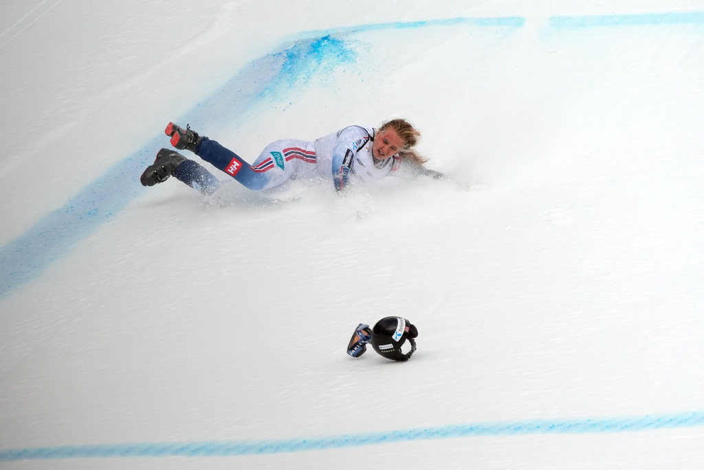 Norway's Marte Monsen crashes during an alpine ski, women's World Cup downhill, in Crans Montana , Switzerland, Friday, Jan. 30, 2026. (AP Photo/Giovanni Auletta)