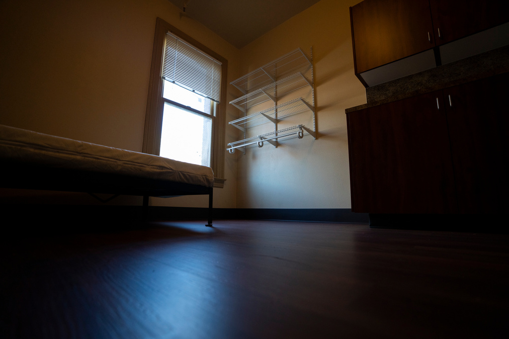 FILE - A window lets light into an empty bedroom in an affordable housing building run by Central City Concern, a homeless services nonprofit, March 15, 2024, in Portland, Ore. (AP Photo/Jenny Kane, File)