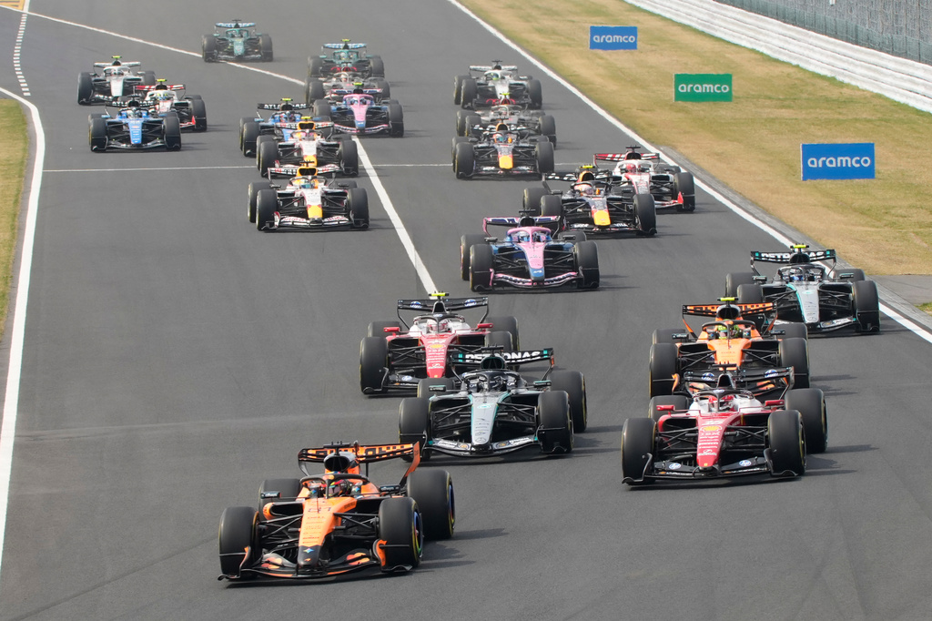 McLaren driver Oscar Piastri of Australia leads the field at the start of the Japanese Formula One Grand Prix at Suzuka in central Japan, Sunday, March 29, 2026. (AP Photo/Eugene Hoshiko)